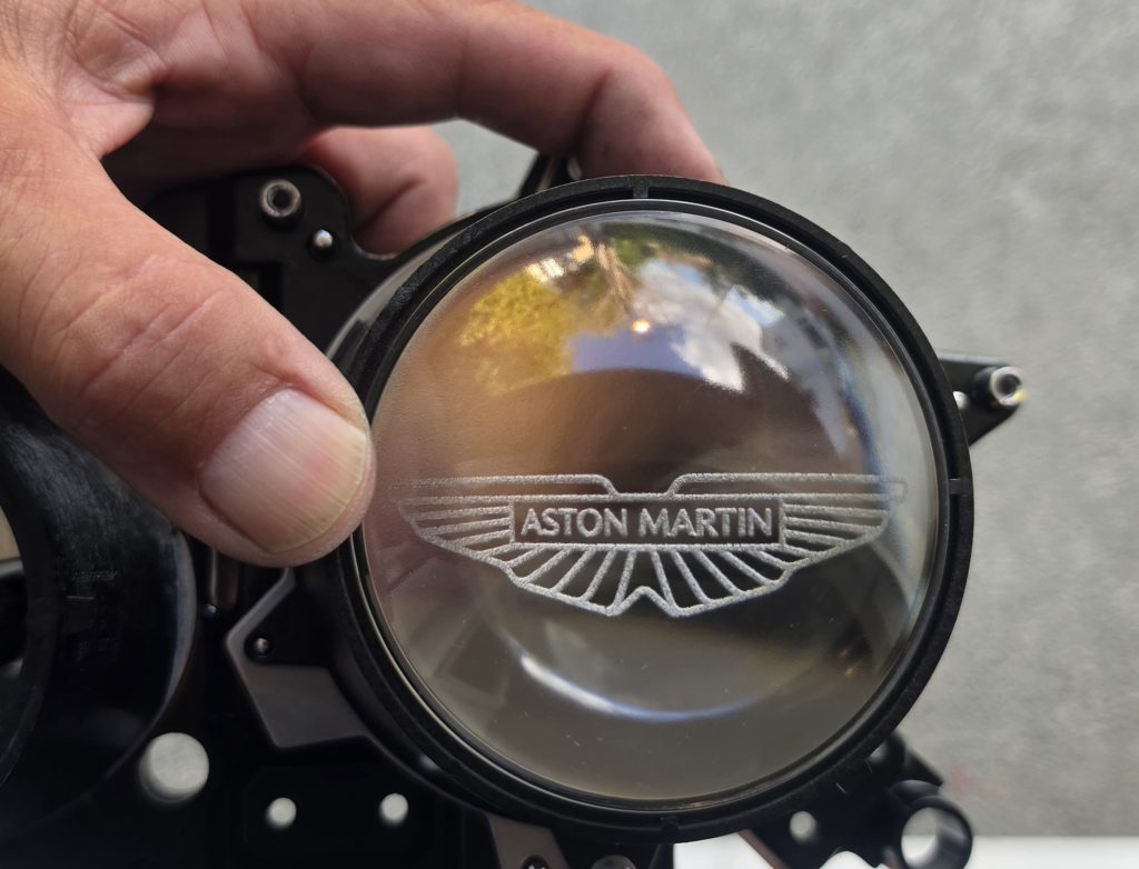Aston Wings on headlight lens